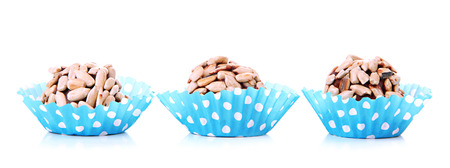 Chocolate candies with sunflower seeds, isolated on whiteの写真素材