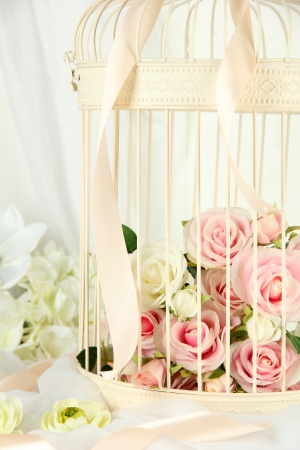 Beautiful decorative cage with beautiful flowersの写真素材