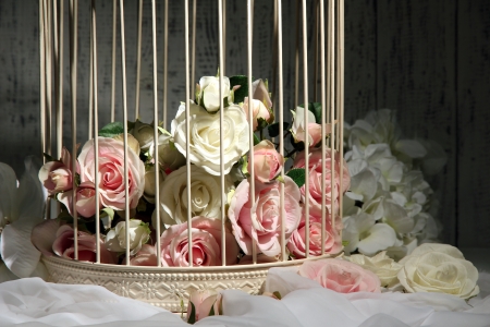 Beautiful decorative cage with beautiful flowersの写真素材