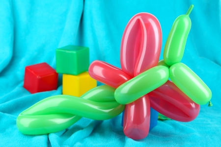Simple balloon animal dragonfly, on bright backgroundの写真素材