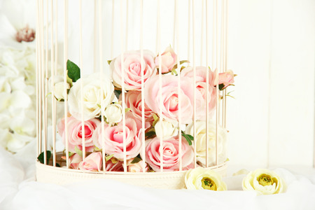 Beautiful decorative cage with beautiful flowersの写真素材