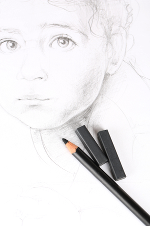 Black drawing charcoals and pencil on picture isolated on whiteの写真素材
