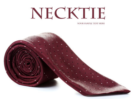 red rolled tie isolated on whiteの写真素材