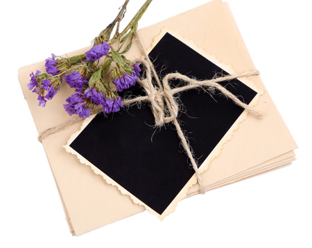 Blank old photo, letters and dried flower, isolated on white