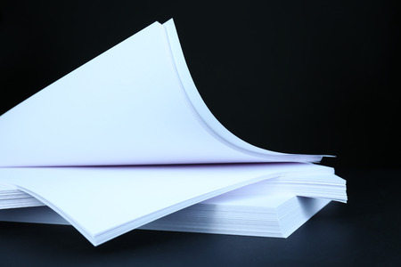 White paper on black close-up