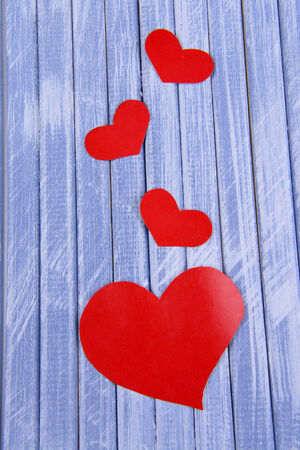 Paper hearts on wooden  の写真素材