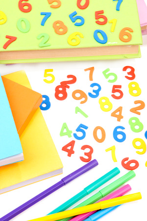 Colorful numbers, abacus, books and markers, isolated on whiteの写真素材