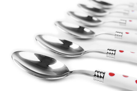 Silver spoons isolated on whiteの写真素材