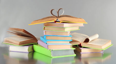 Stacks of books on grey の写真素材