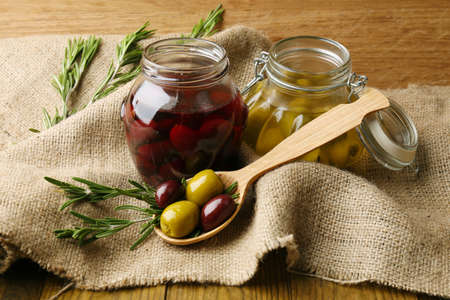 Tasty olives on wooden tableの写真素材
