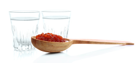 Glasses of vodka, red caviar  isolated on whiteの写真素材