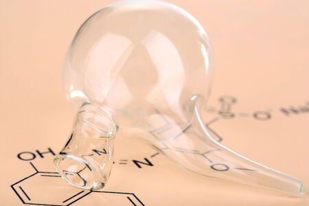 Test tube and reaction formula, close-upの写真素材