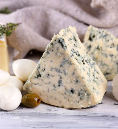 Different tasty cheese, on wooden tableの写真素材