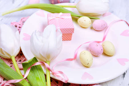Easter table setting with tulips and eggs