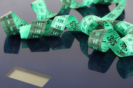 Measuring tape and scales close-up