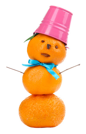 Snowman, prepared with tangerines, isolated on whiteの写真素材