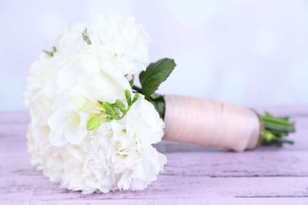 Beautiful wedding bouquet on table on bright backgroundの写真素材