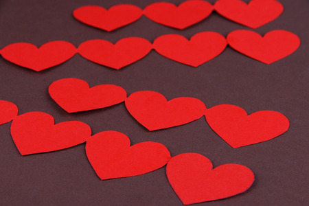 Paper hearts on wooden background