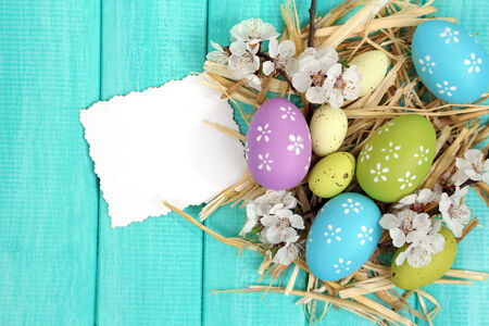 Easter composition with flowering branches on wooden table close-up