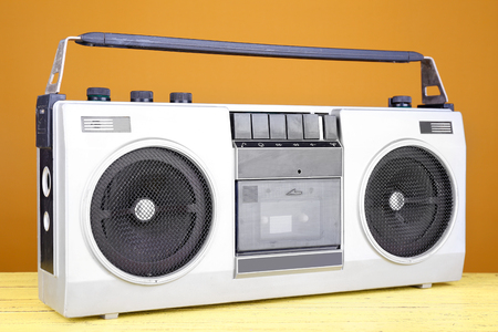 Retro cassette stereo recorder on table on yellow backgroundの写真素材