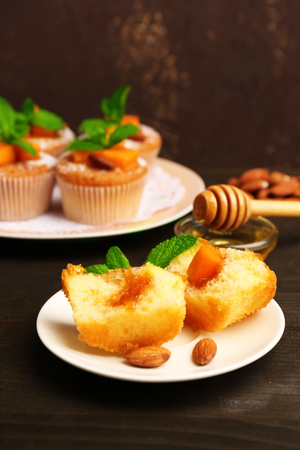 Tasty pumpkin muffins on wooden tableの写真素材