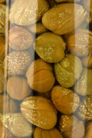 Glass jar with tinned capers close-upの写真素材