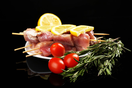 Raw pork kebab on black backgroundの写真素材