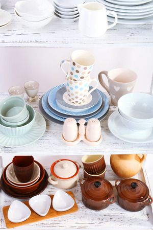 Different tableware on shelf, close upの写真素材