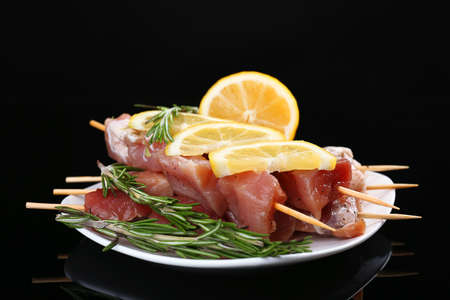 Raw pork kebab on black backgroundの写真素材