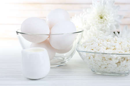 Tasty dairy products on wooden table