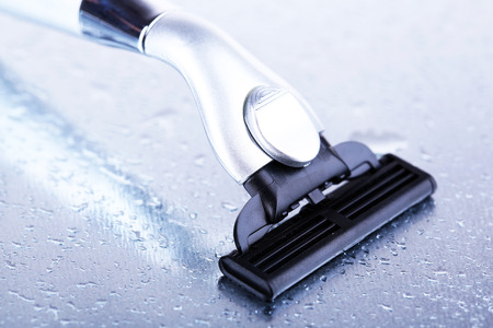 Shaving razor on gray backgroundの写真素材