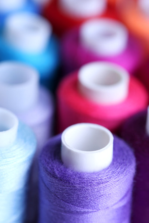 Multicolor sewing threads background