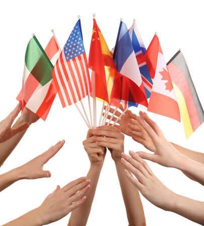 Hands holding different flags, isolated on whiteの写真素材