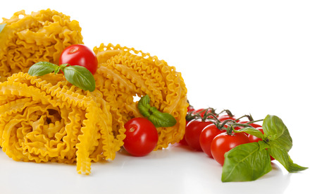 Raw homemade pasta and tomatoes, isolated on whiteの写真素材