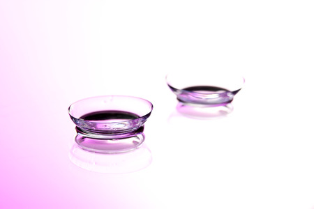 contact lenses, on pink backgroundの写真素材