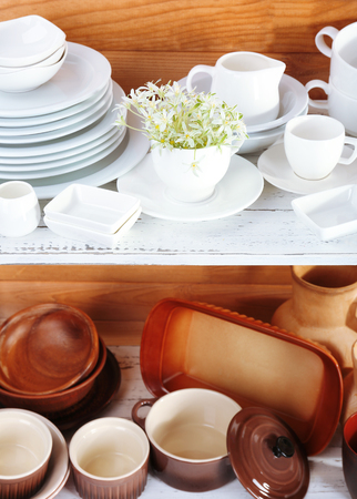 Different tableware on shelf, on wooden backgroundの写真素材