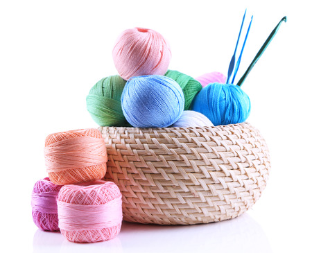 Colorful clews and crochet hooks in box isolated on whiteの写真素材