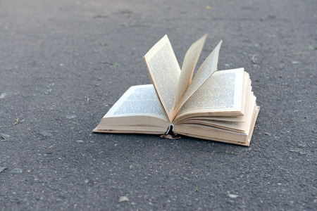 Open book on road outdoorsの写真素材