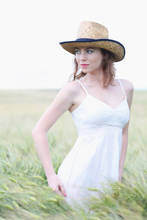 Beautiful young woman in fieldの写真素材