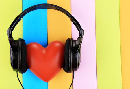 Headphones and hearts on wooden backgroundの写真素材