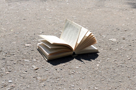 Open book on road outdoorsの写真素材