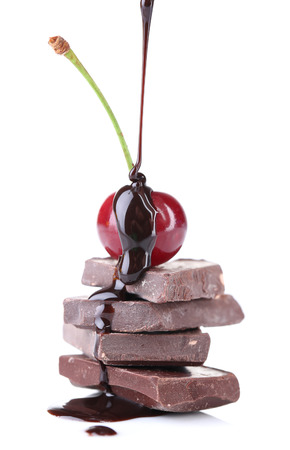 Cherry and chopped chocolate isolated on whiteの写真素材