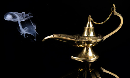 Magic lamp isolated on blackの写真素材