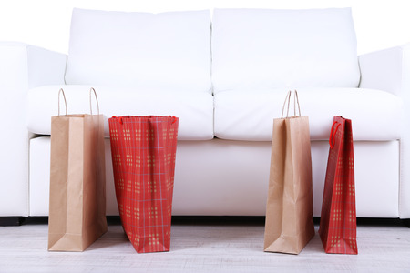 Bags of shopping on sofa background close-upの写真素材