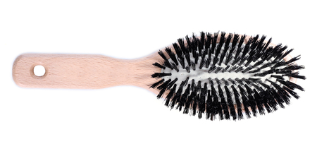 Wooden hairbrush isolated on white の写真素材