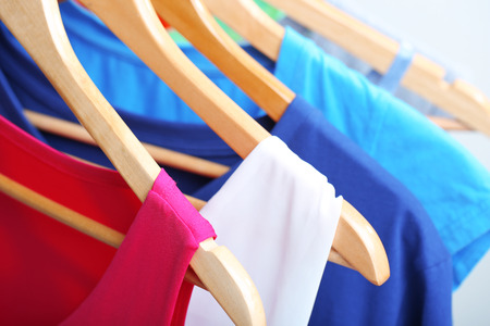 Clothes on circle hanger on light backgroundの写真素材