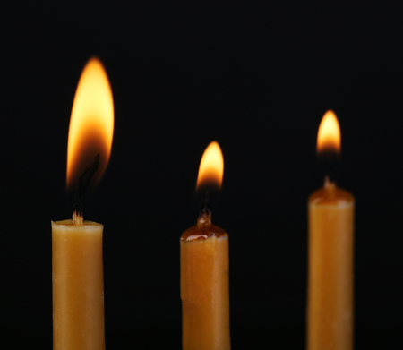 Burning candles on black backgroundの写真素材