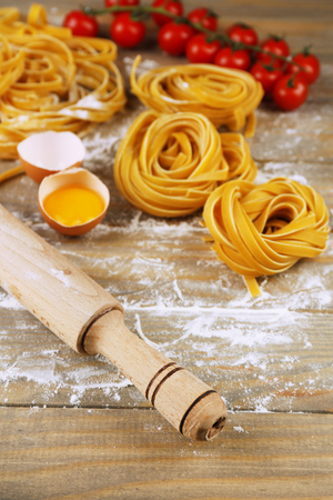 Still life with raw homemade pasta and ingredients for pastaの写真素材