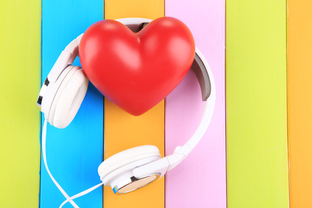 Headphones and hearts on wooden backgroundの写真素材