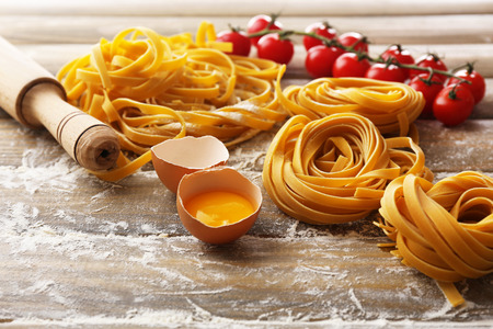 Still life with raw homemade pasta and ingredients for pastaの写真素材